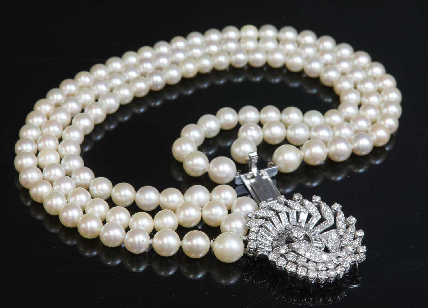 A three row graduated cultured pearl necklace, c.1950,