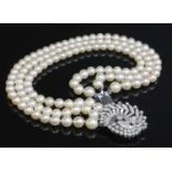 A three row graduated cultured pearl necklace, c.1950,