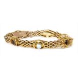 A gold garnet and blister pearl gate bracelet,