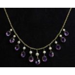 An Edwardian amethyst and split pearl fringe necklace, c.1900,