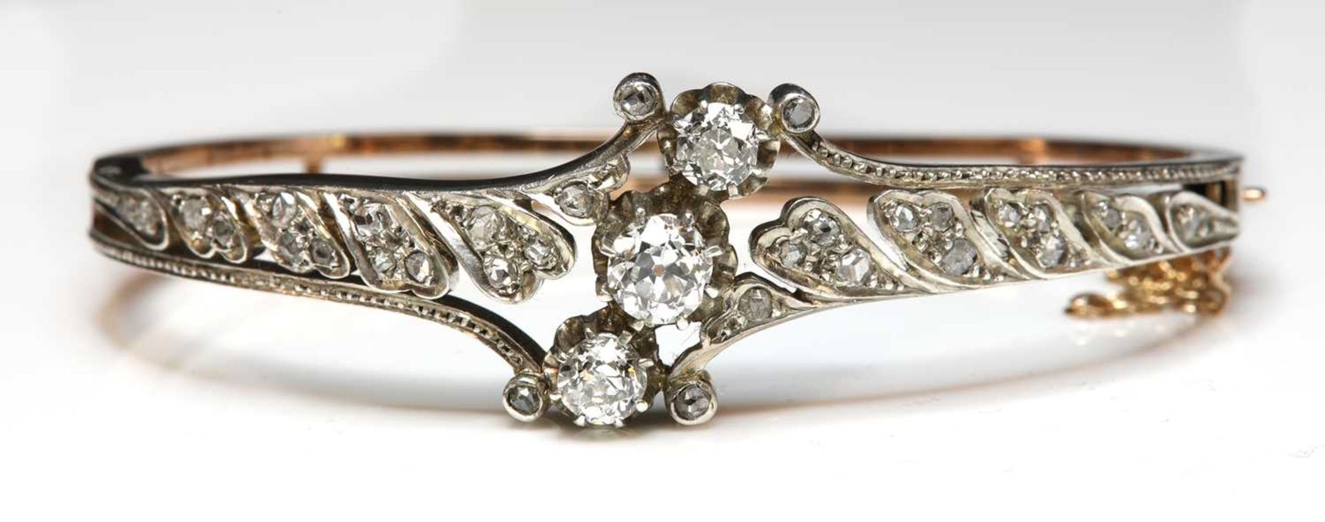 A French diamond set hinged bangle, c.1890,