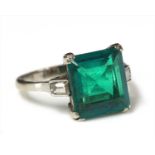 A white gold single stone Colombian emerald ring,