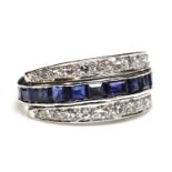 An 18ct white gold sapphire and diamond half hoop ring,