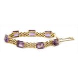 A gold amethyst three row panther link bracelet,