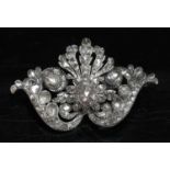 An antique diamond set brooch,