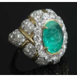 An emerald and diamond bombé form ring by David Webb,