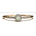 A Victorian gold opal and diamond cluster bangle, c.1890,