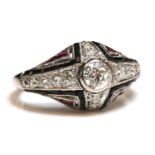 An Art Deco diamond, onyx and synthetic ruby bombé ring, c.1930,