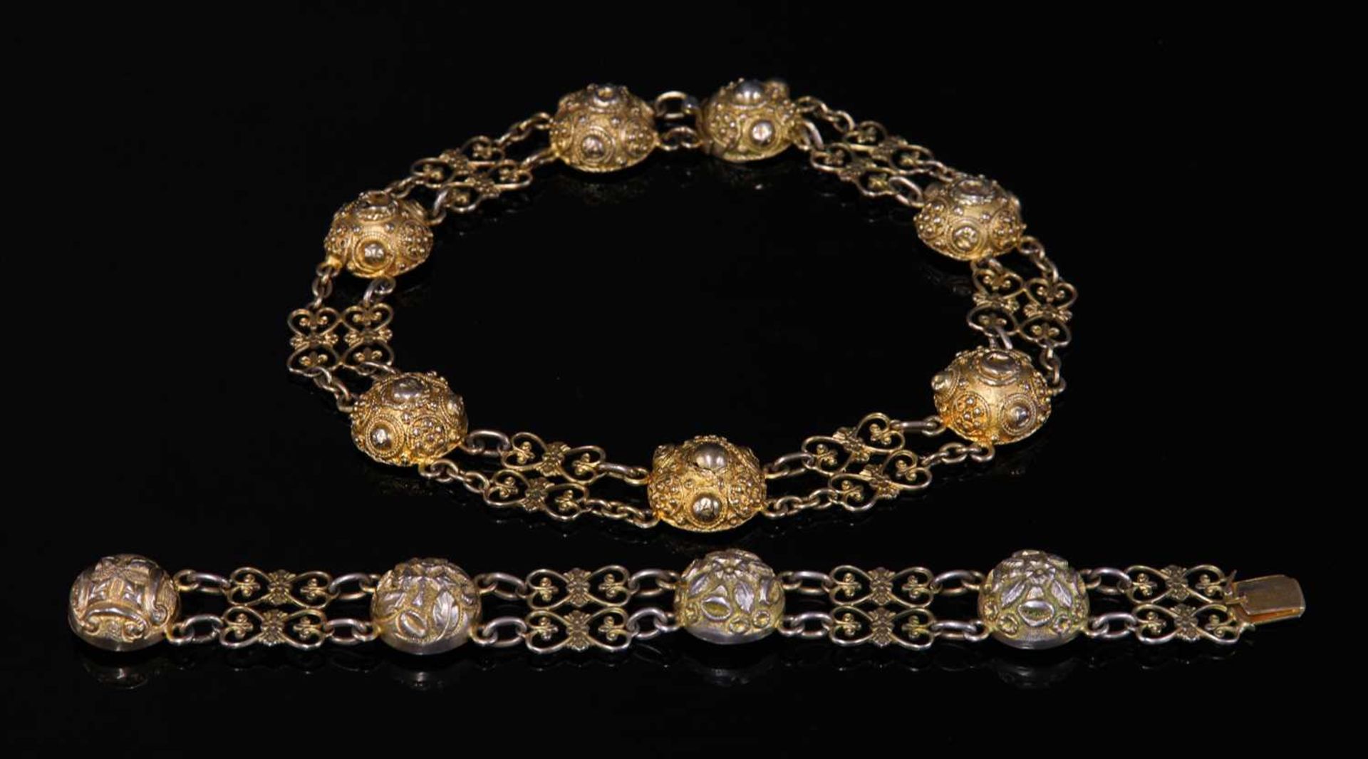 A Victorian silver gilt necklace and bracelet suite,