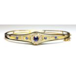 An Edwardian gold sapphire and diamond bangle, c.1900,