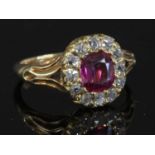 A late Victorian ruby and diamond cushion-shaped cluster ring,