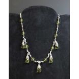 A two colour gold citrine or lemon quartz necklace and earring suite,