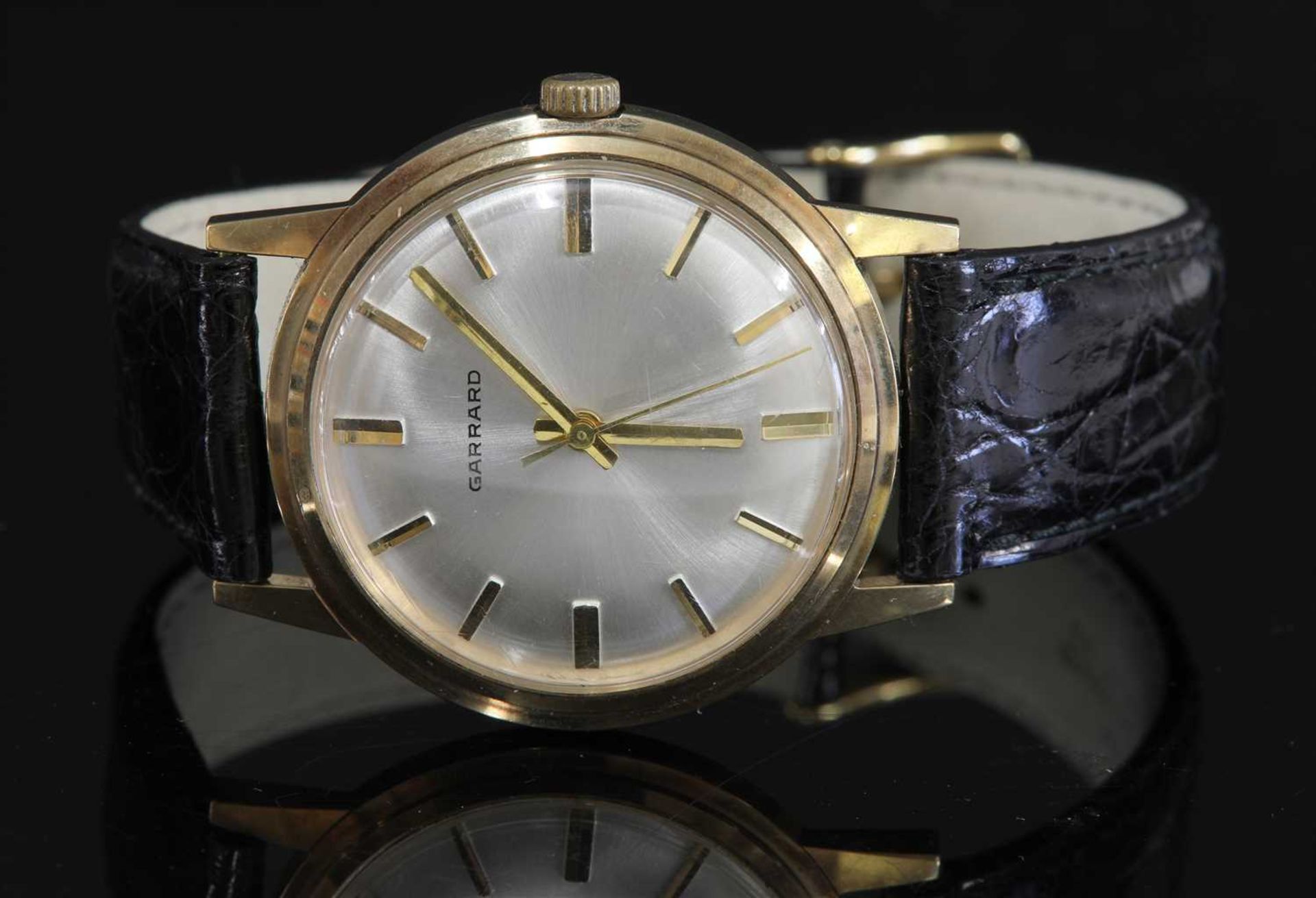 A gentlemen's 9ct gold Garrard mechanical strap watch, c.1970,