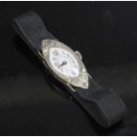 A ladies' 18ct white gold diamond set cocktail strap watch, c.1928,