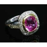 An 18ct gold pink sapphire and diamond cluster ring