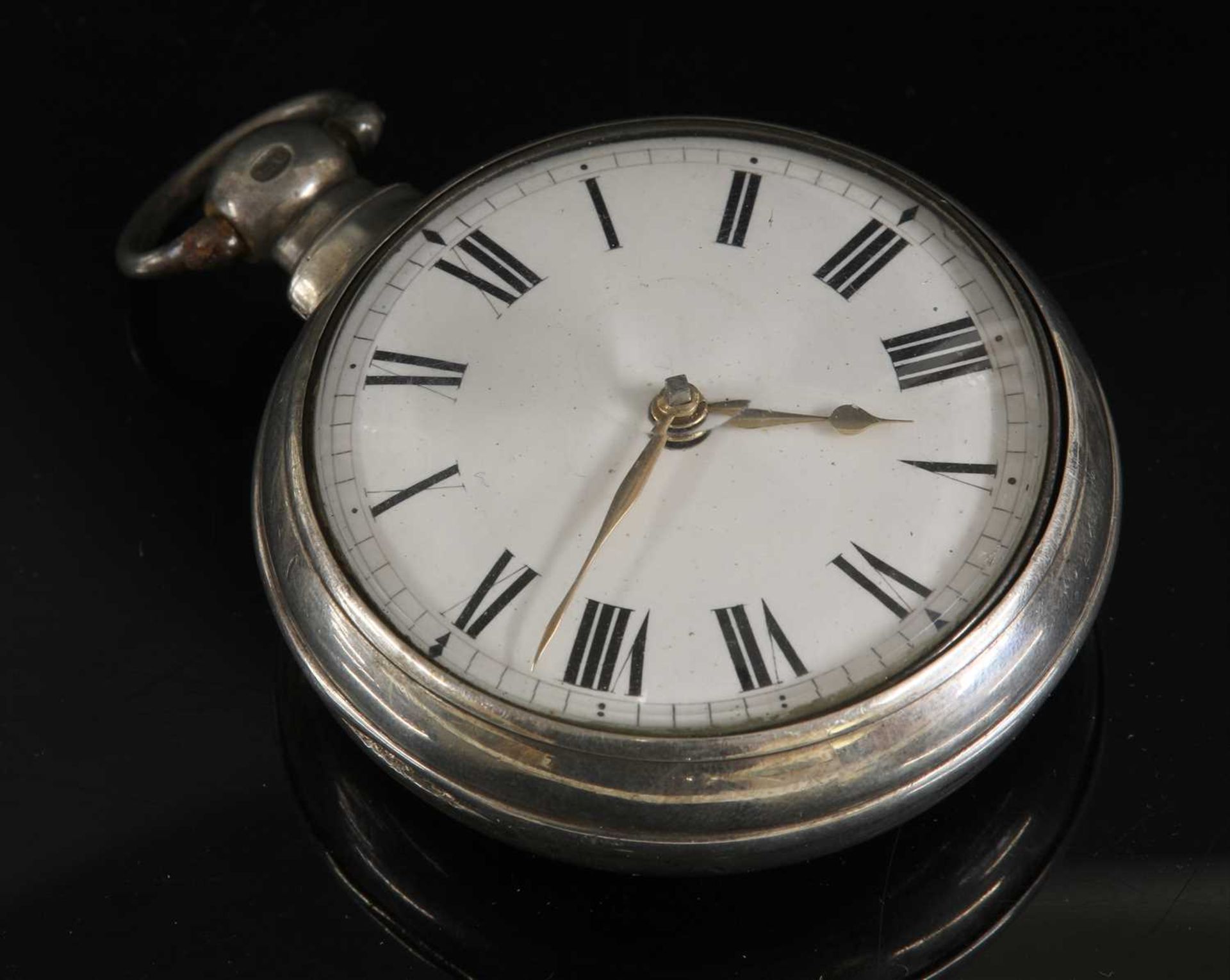 A sterling silver pair cased pocket watch,