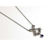 A white gold Belle Époque-style sapphire and diamond swag pendant,