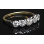 A two colour gold graduated five stone diamond ring,