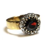 A garnet and diamond cluster ring,