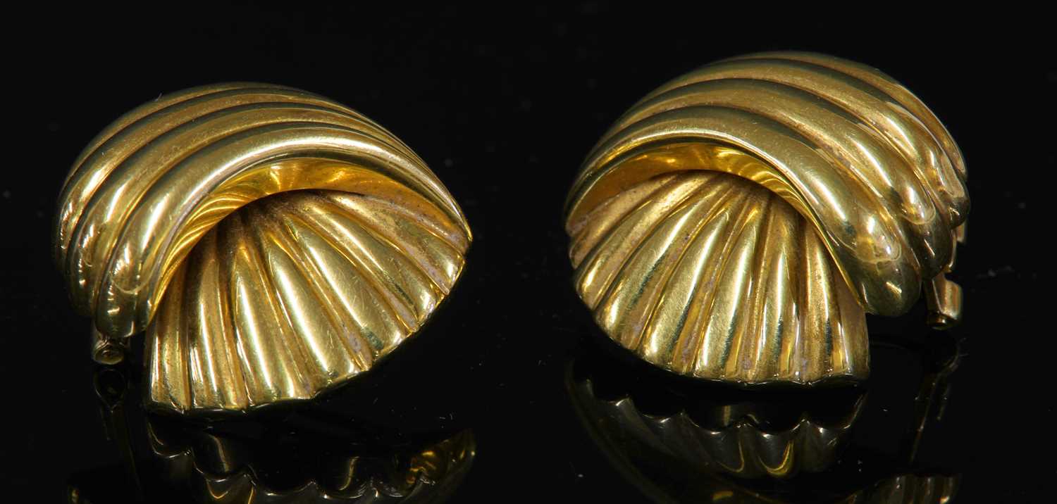 A pair of 18ct gold gadroon shell form earrings,