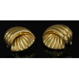 A pair of 18ct gold gadroon shell form earrings,