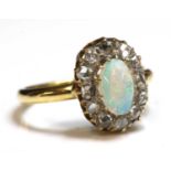 A gold opal and diamond oval cluster ring,