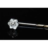 A cased single stone diamond stick pin,