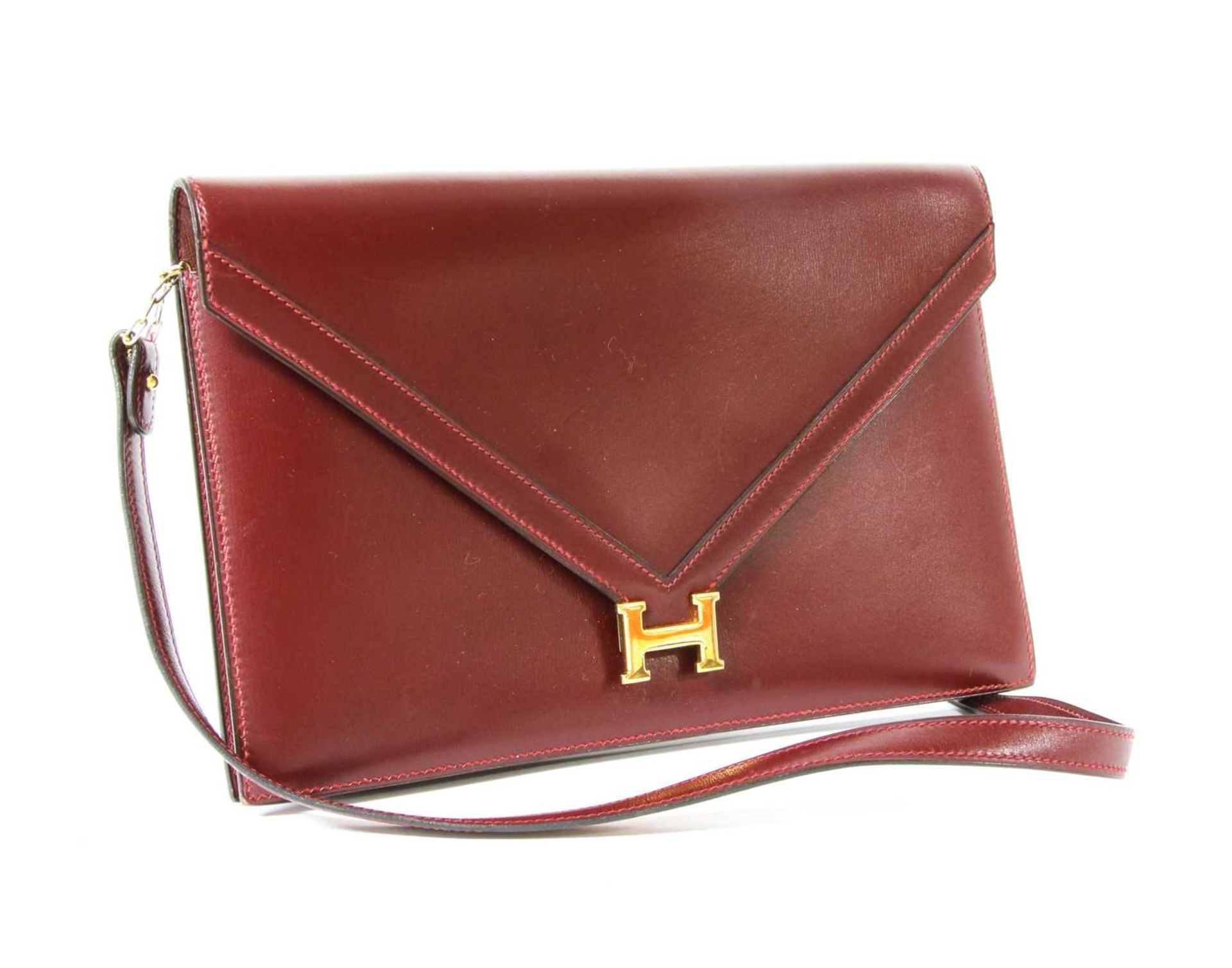 An Hermès 'Lydie' red clutch bag,