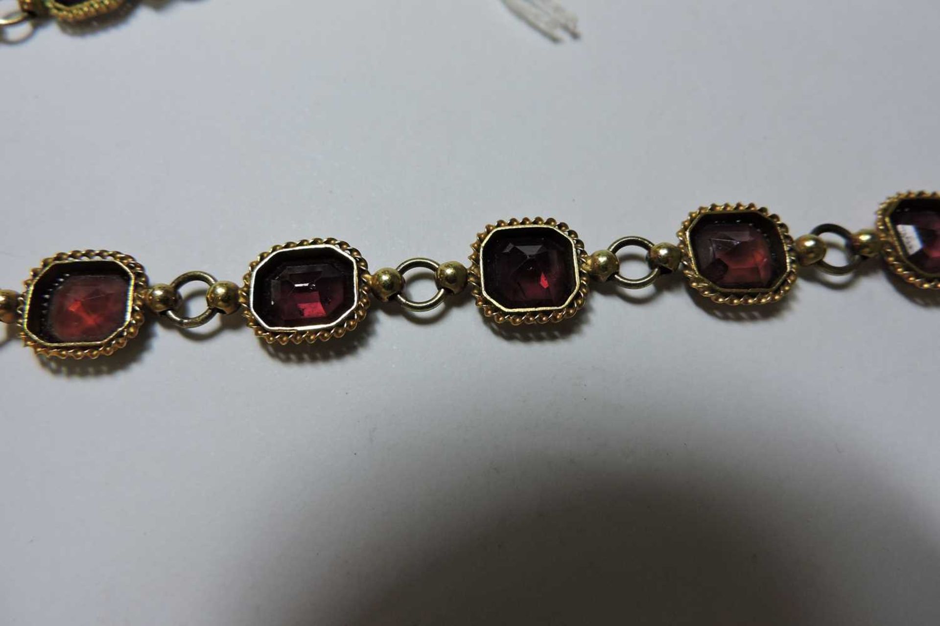 A gold garnet set rivière necklace, - Bild 4 aus 4