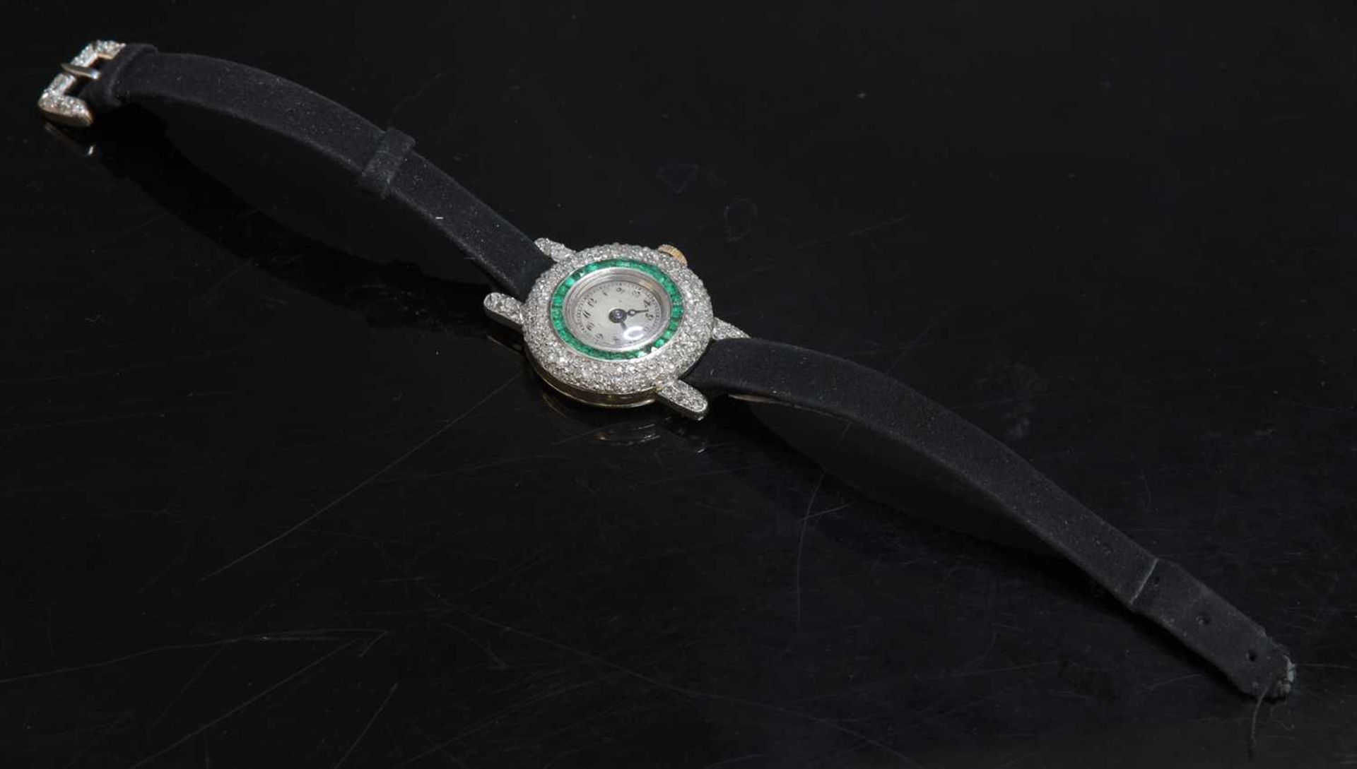 A ladies' Art Deco 18ct two colour gold Longines emerald and diamond cocktail watch, c.1920,