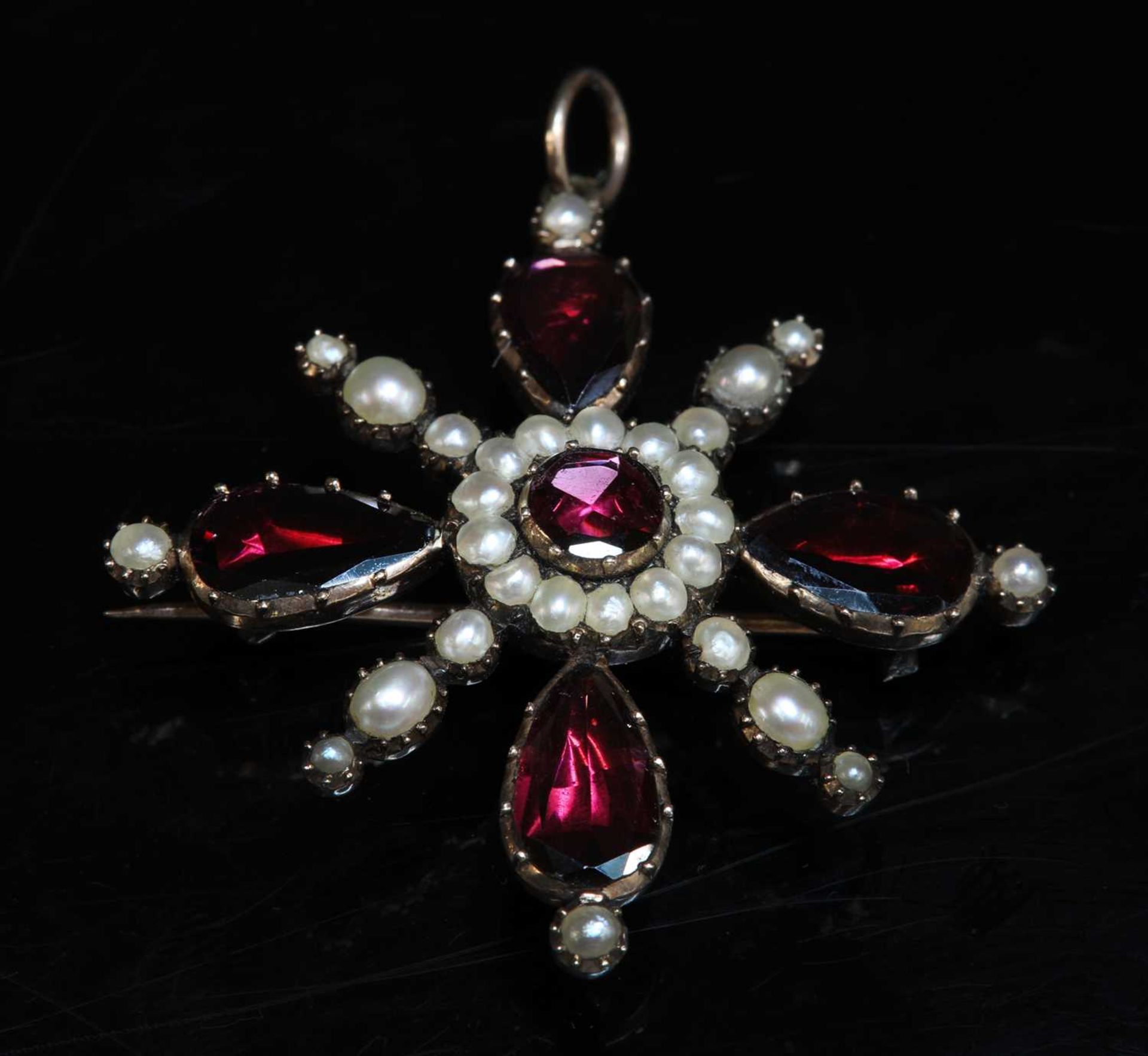 A Georgian gold foiled garnet and split pearl cruciform brooch/pendant,