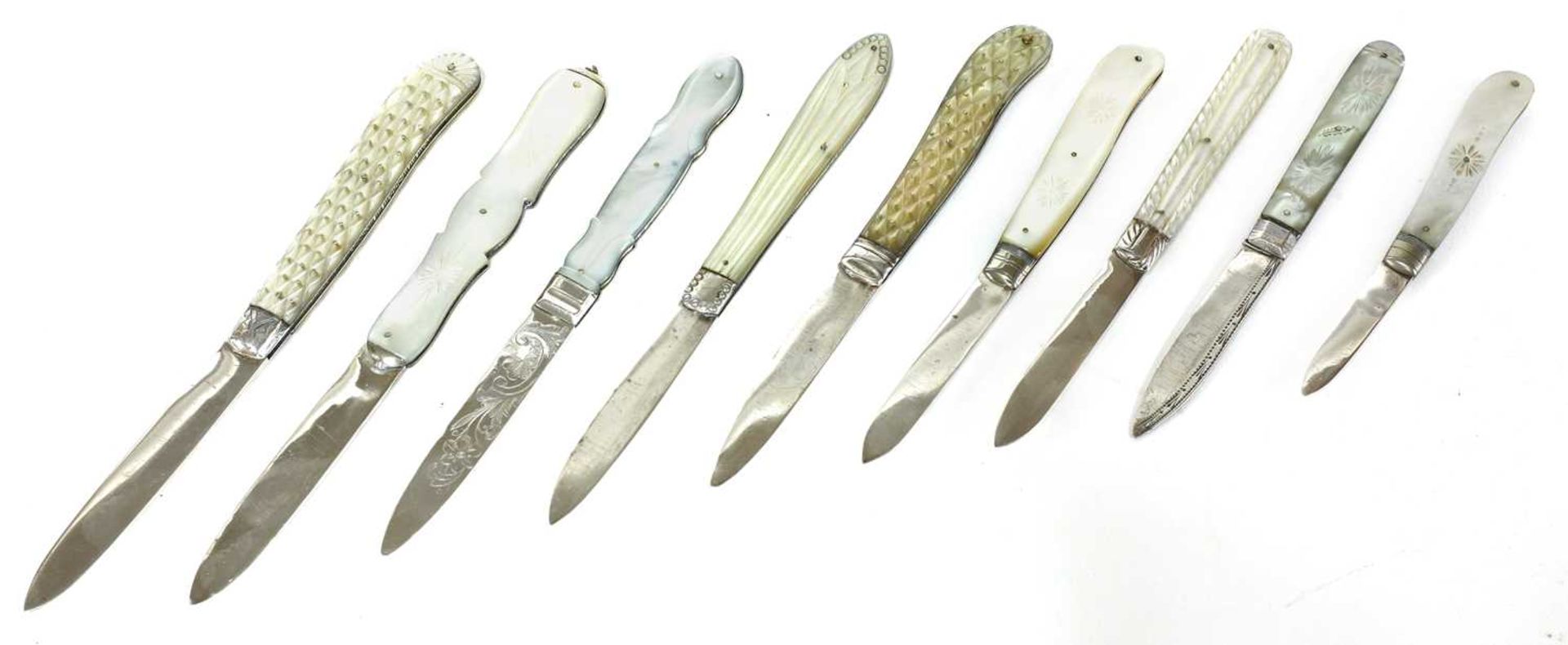 Nine silver and mother-of-pearl folding fruit knives,