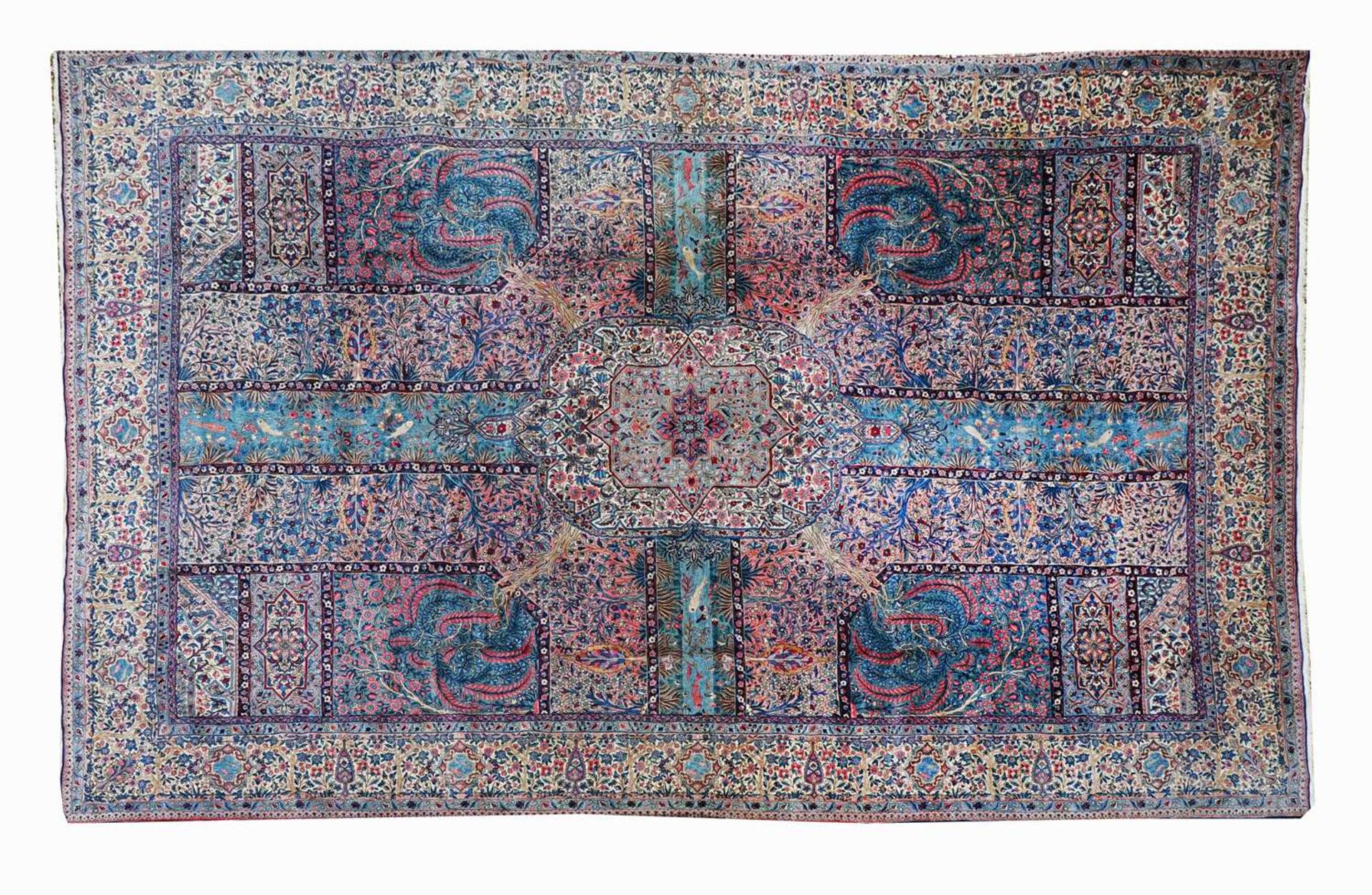 A large Persian Kirman carpet,