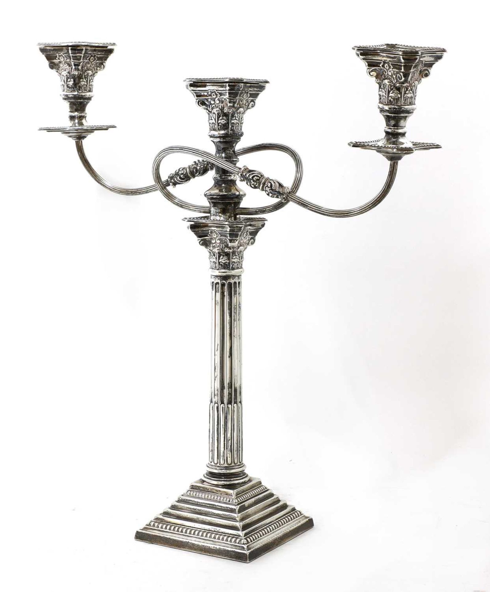 A George V silver three-light Corinthian column candelabrum