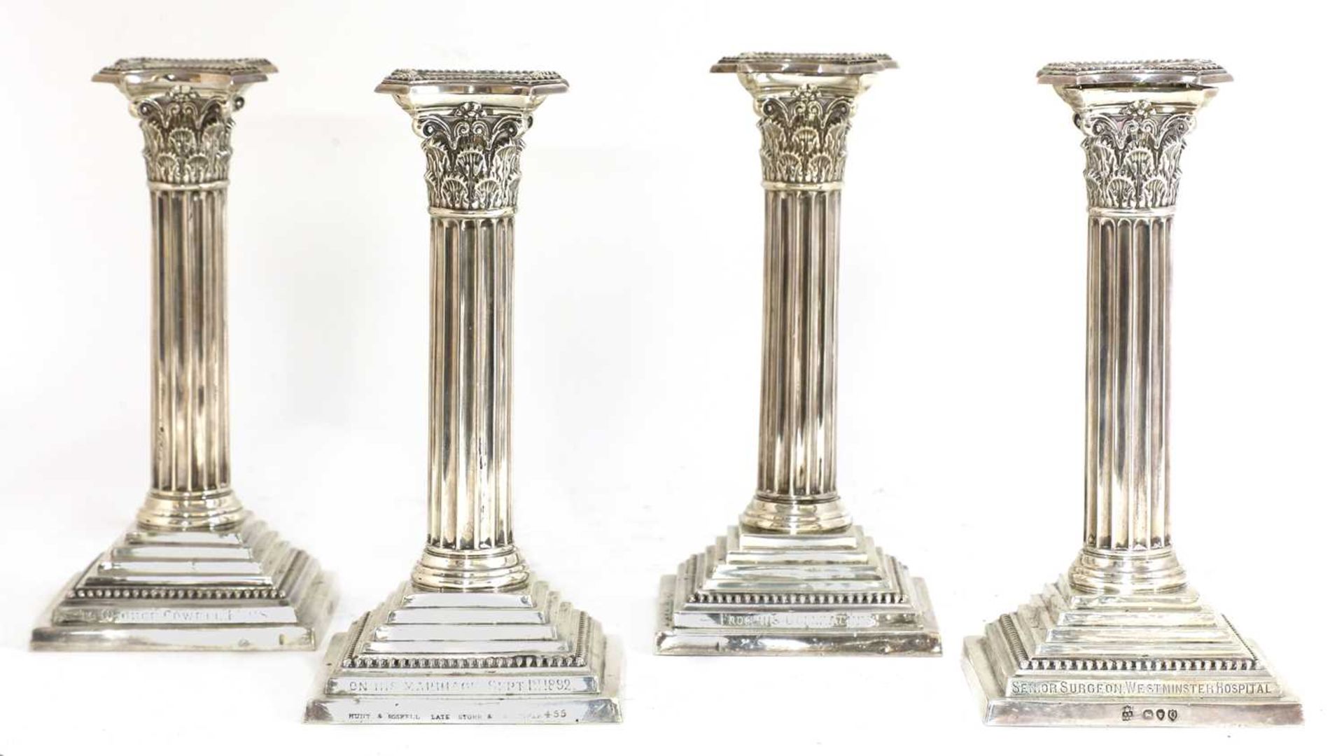 A set of four silver candlesticks,
