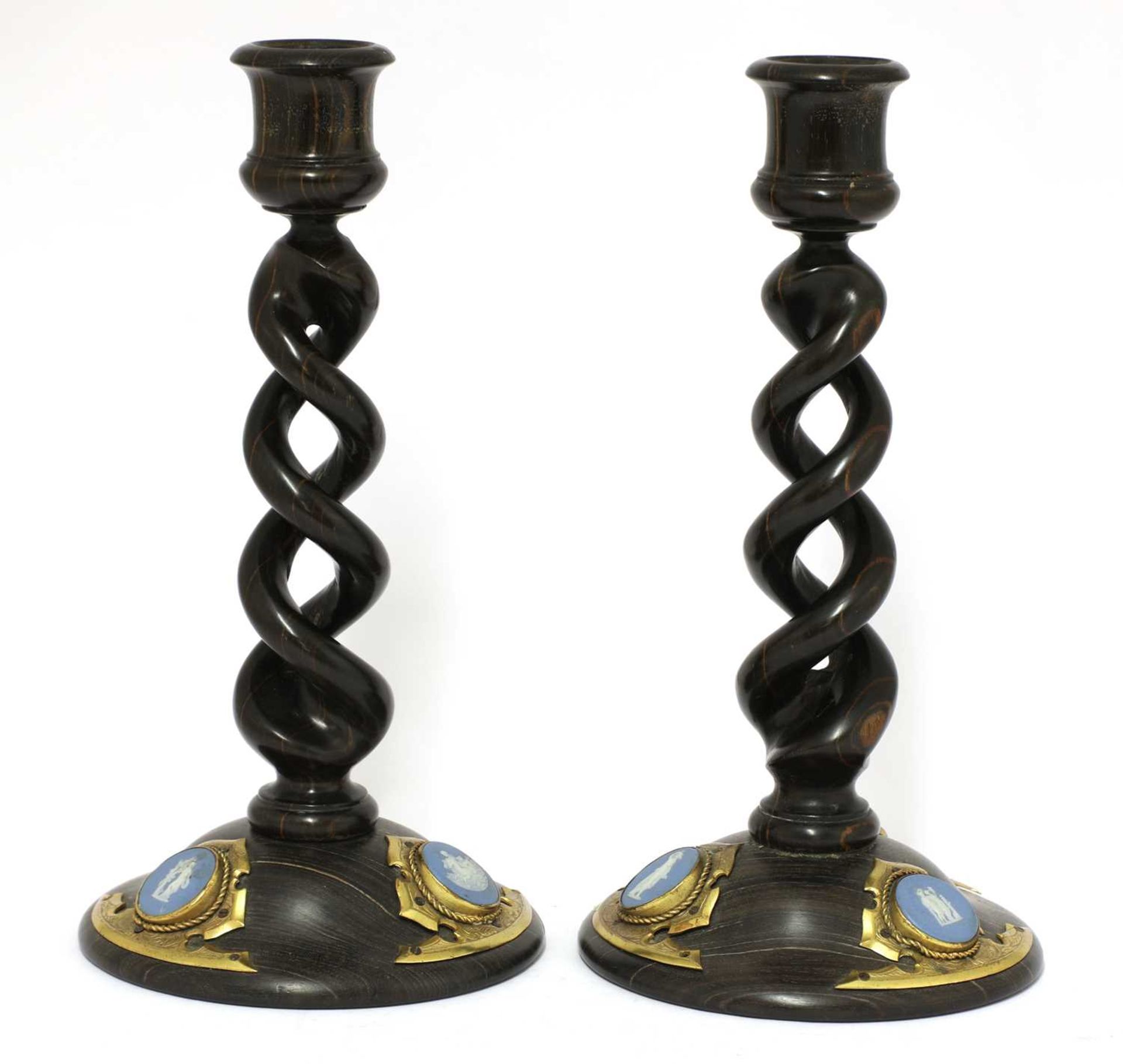 A pair of open twist candlesticks,