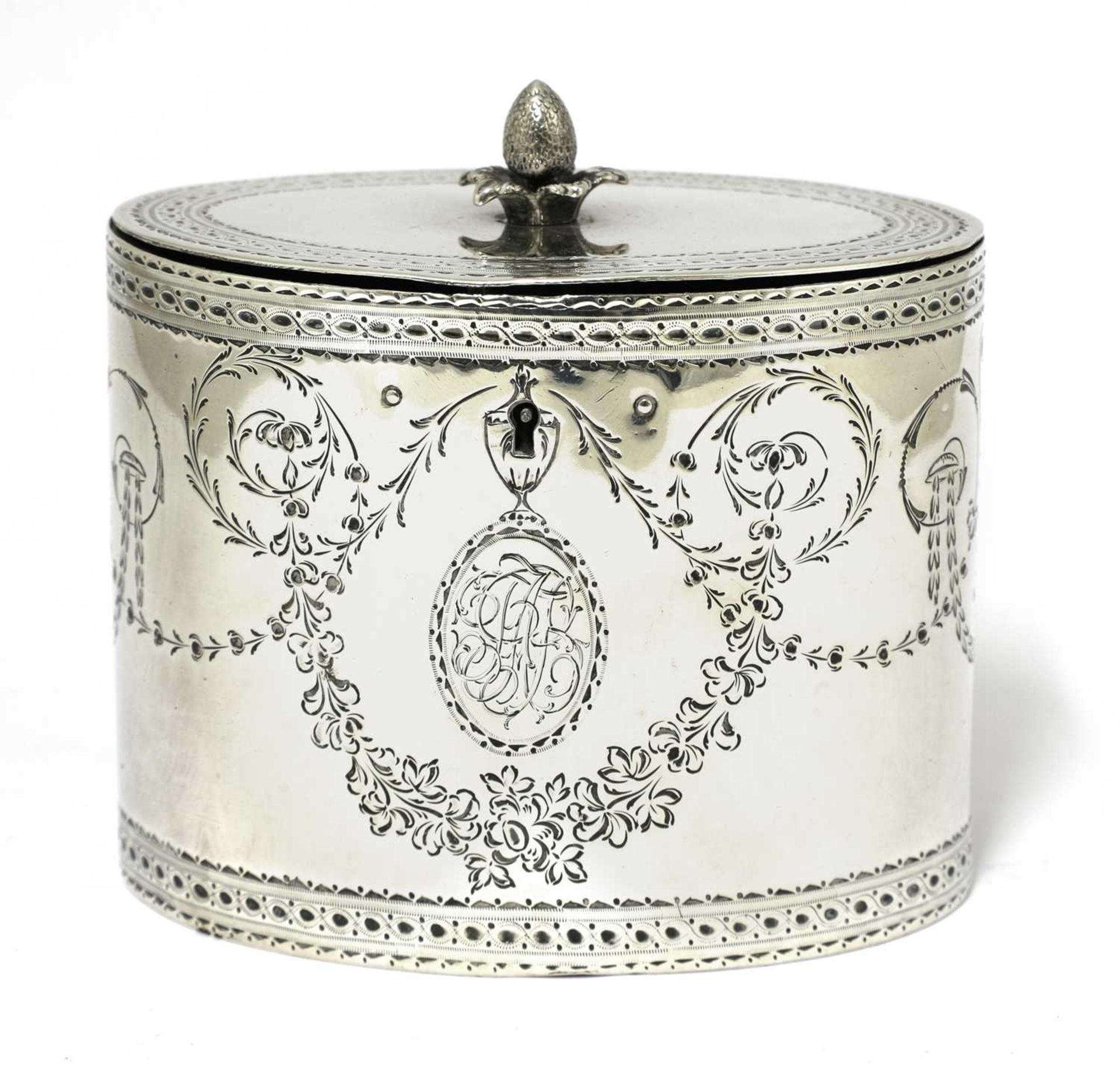 A George III silver oval tea caddy,