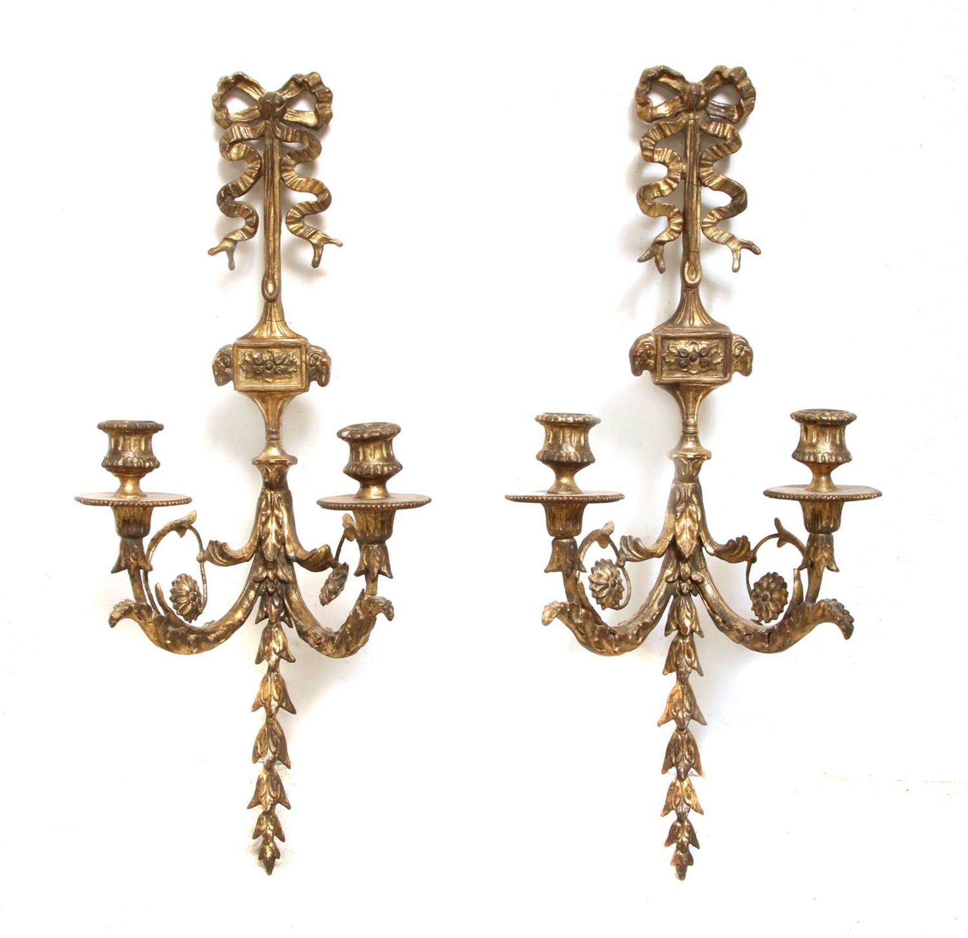 A pair of neoclassical two-branch wall sconces,