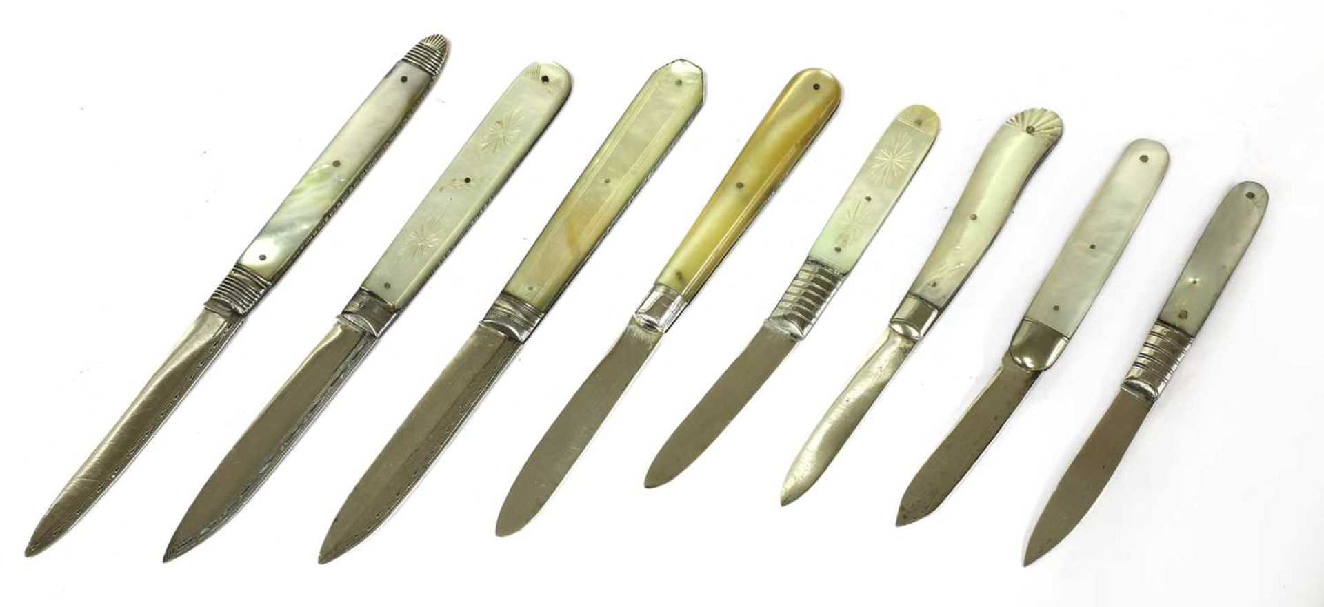 Eight silver and mother-of-pearl folding fruit knives,