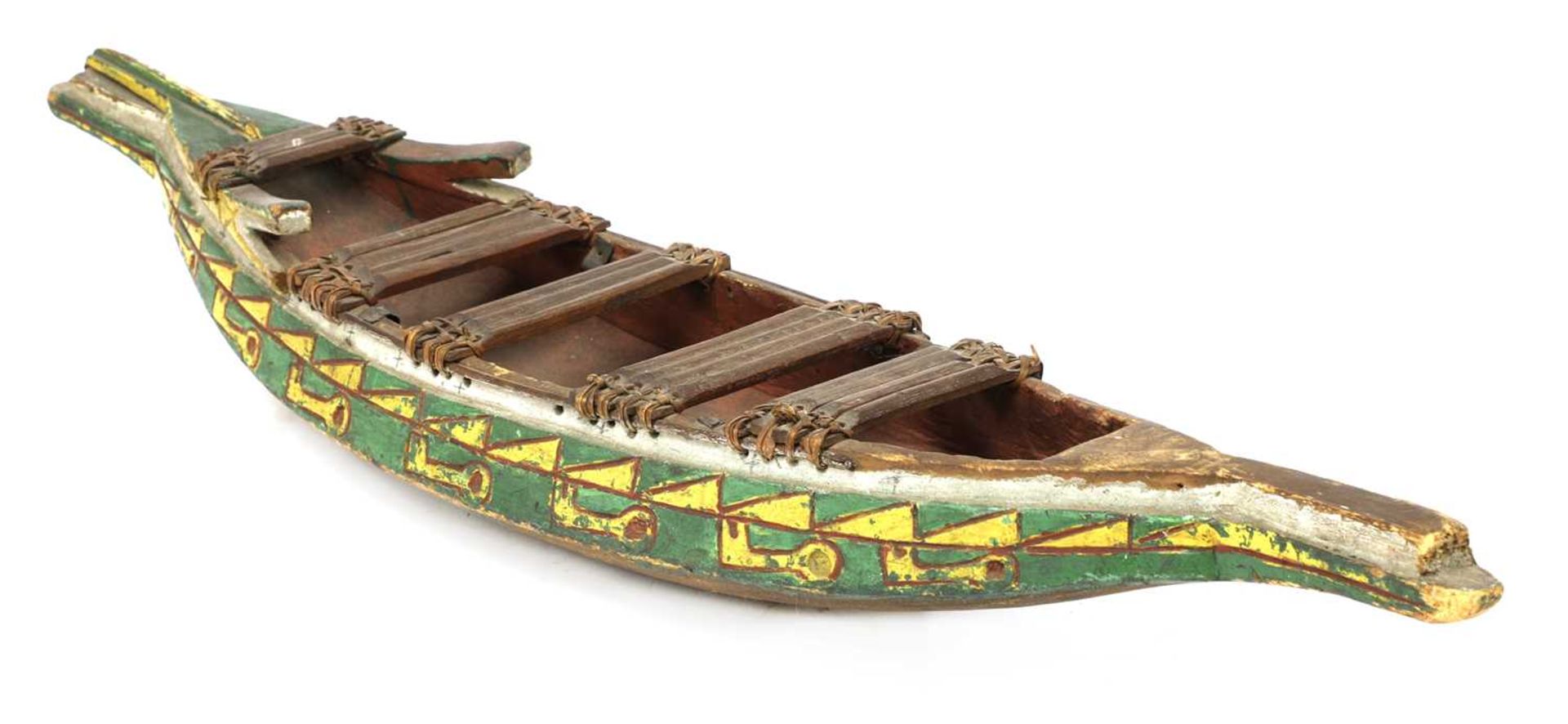 A carved wooden and painted model barge,