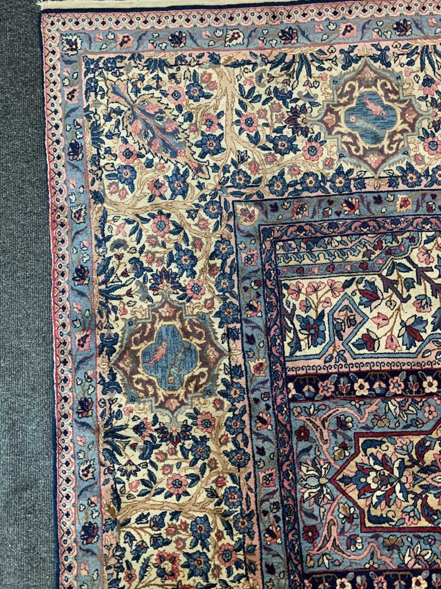 A large Persian Kirman carpet, - Image 4 of 18