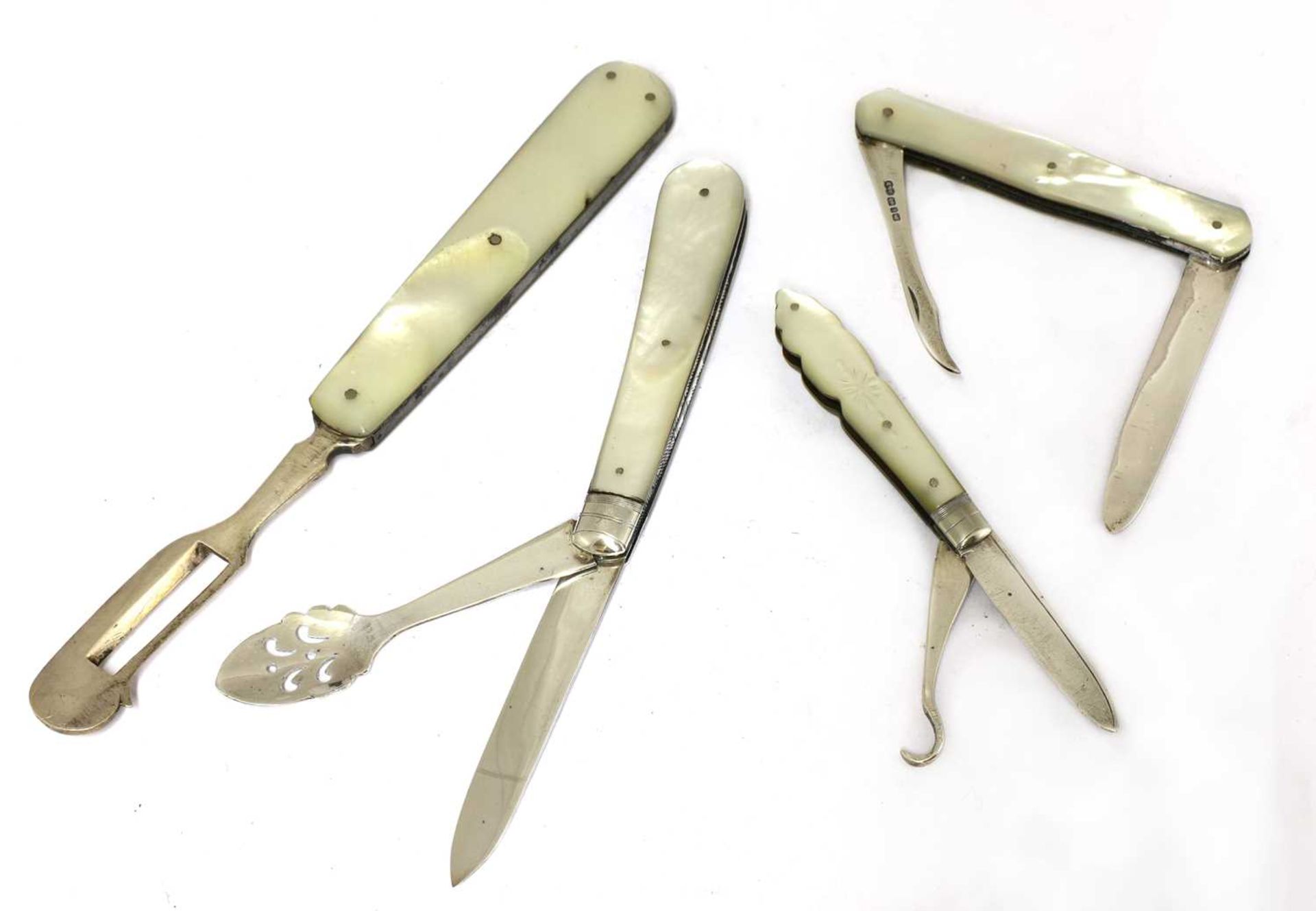 Three silver and mother-of-pearl combination folding fruit knives,