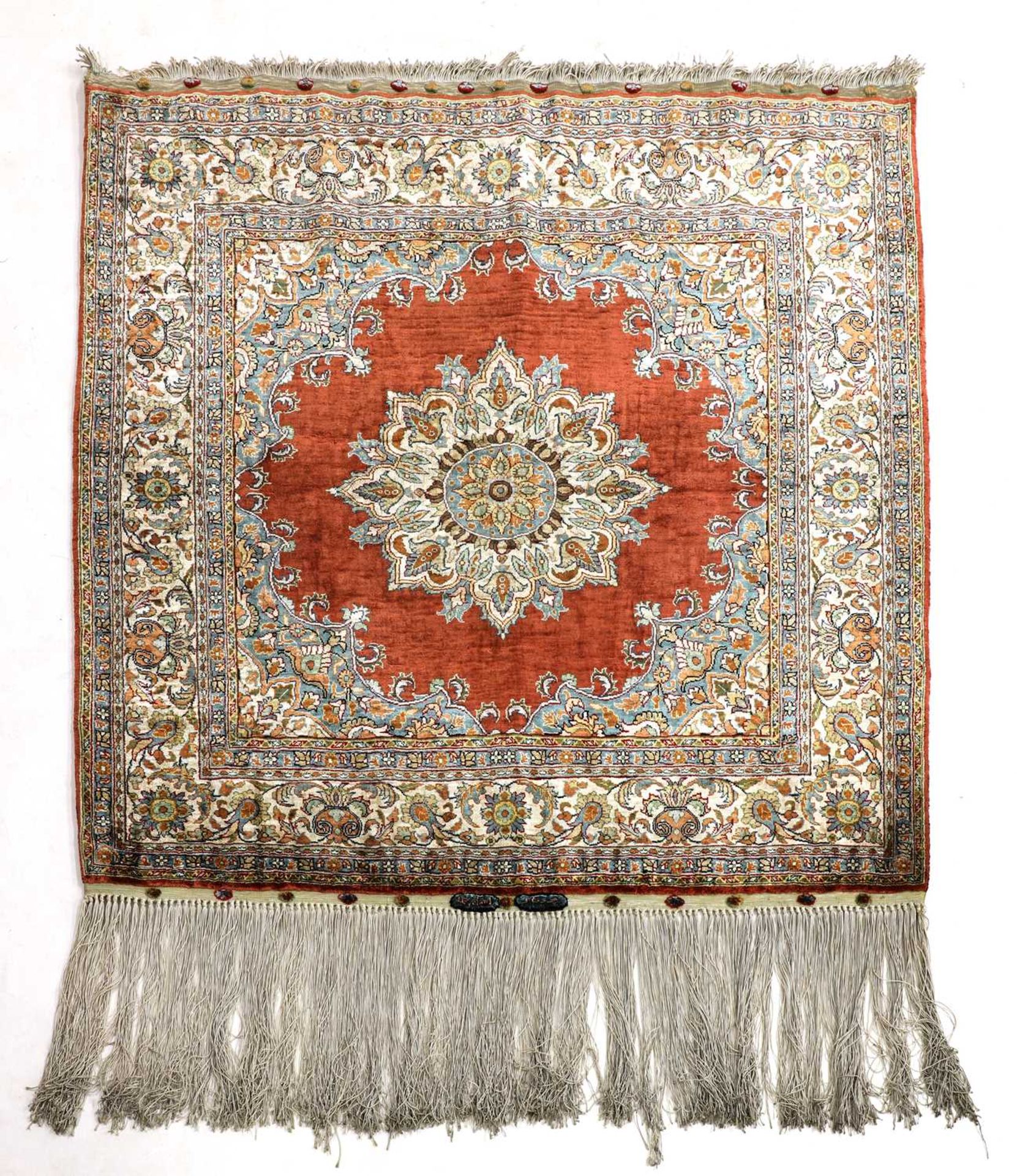 A small silk Hereke rug,