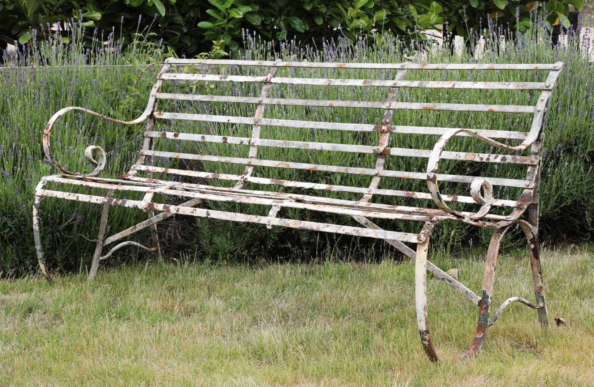 A steel three-seater garden bench,