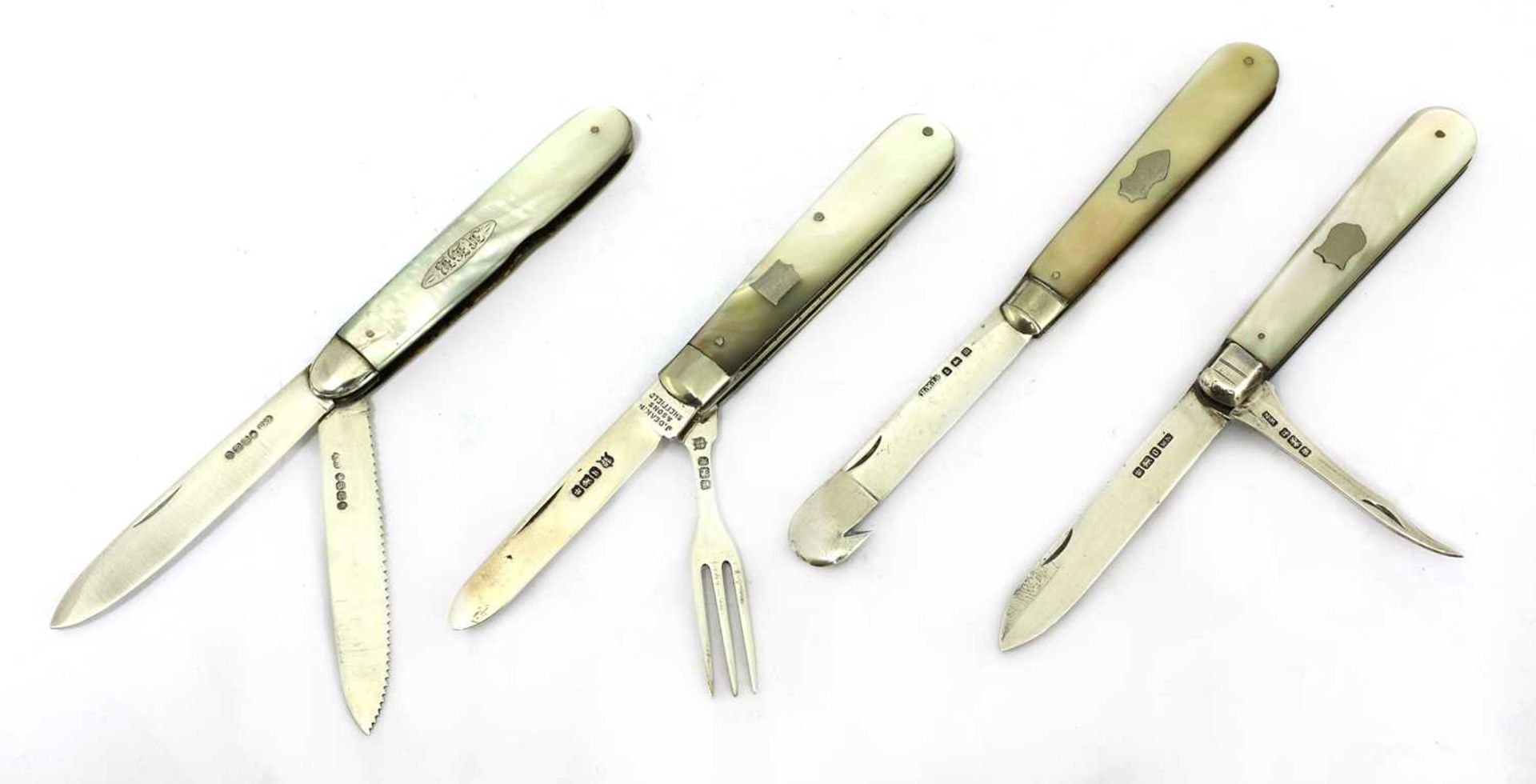Four silver and mother-of-pearl folding fruit knives,