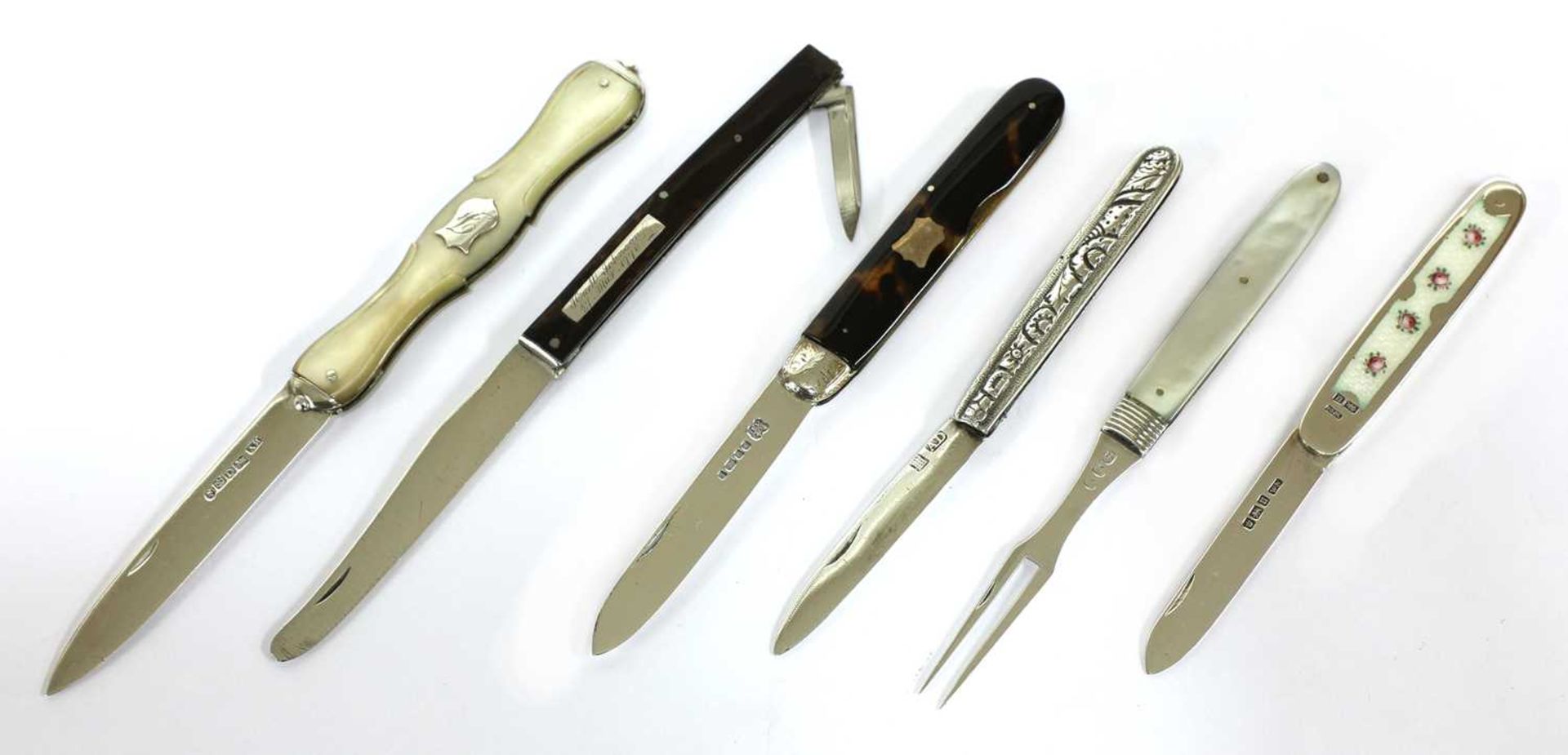 Five various silver folding fruit knives and fork,