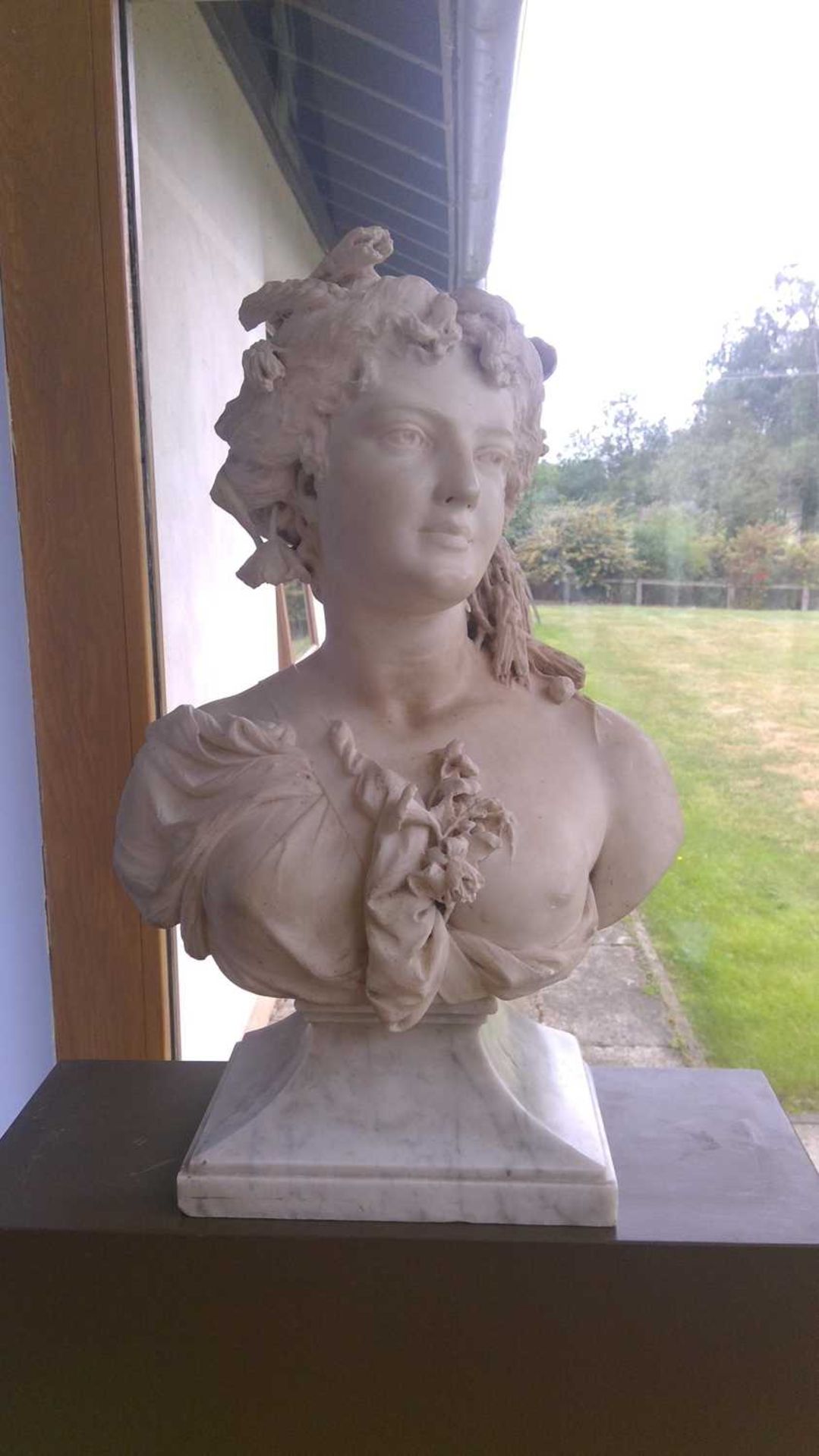 A carved marble bust emblematic of Flora, - Image 9 of 32