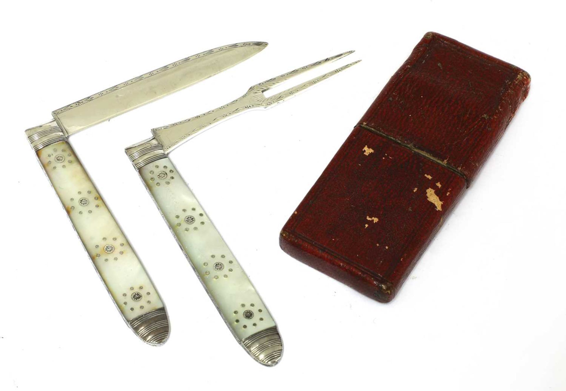 A Georgian silver and mother-of-pearl folding fruit knife and fork,