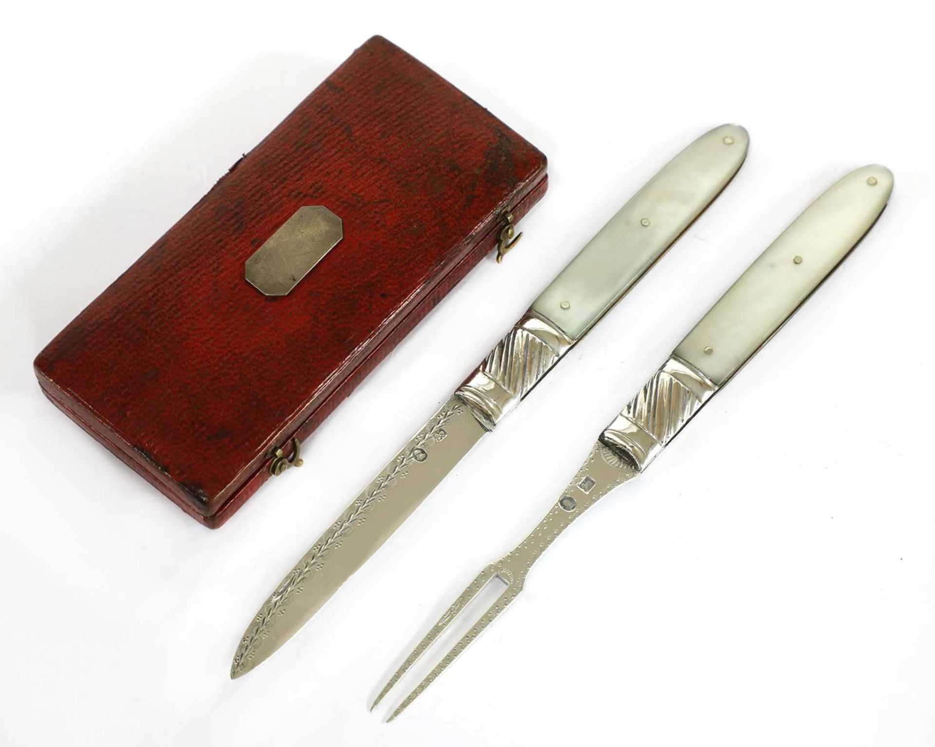 A mother-of-pearl and silver folding fruit knife and fork set,