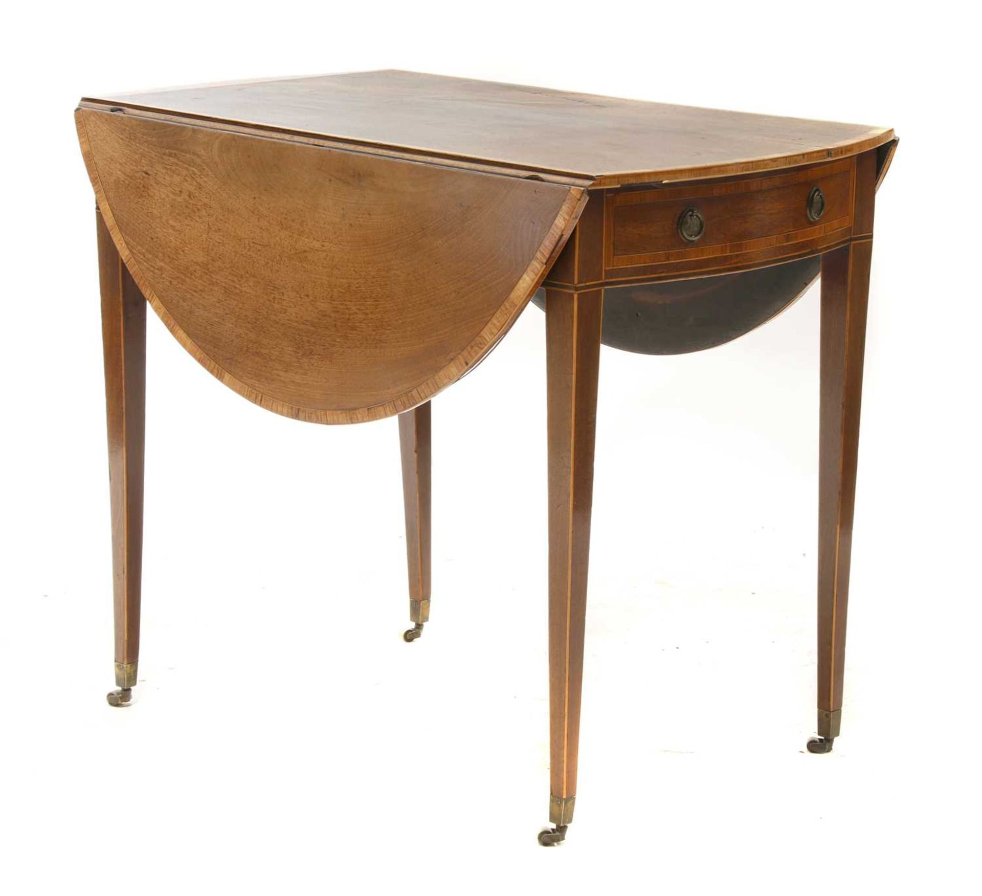 A Sheraton period mahogany oval Pembroke table,
